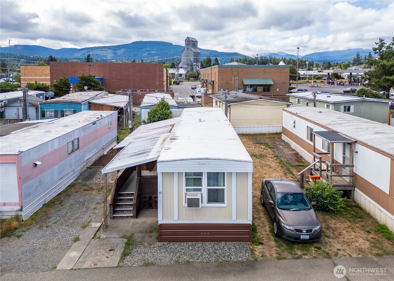 201 North 5th Avenue, Unit 19 Sequim, WA 98382 - Photo 2 of 25 a view of a white house with a yard