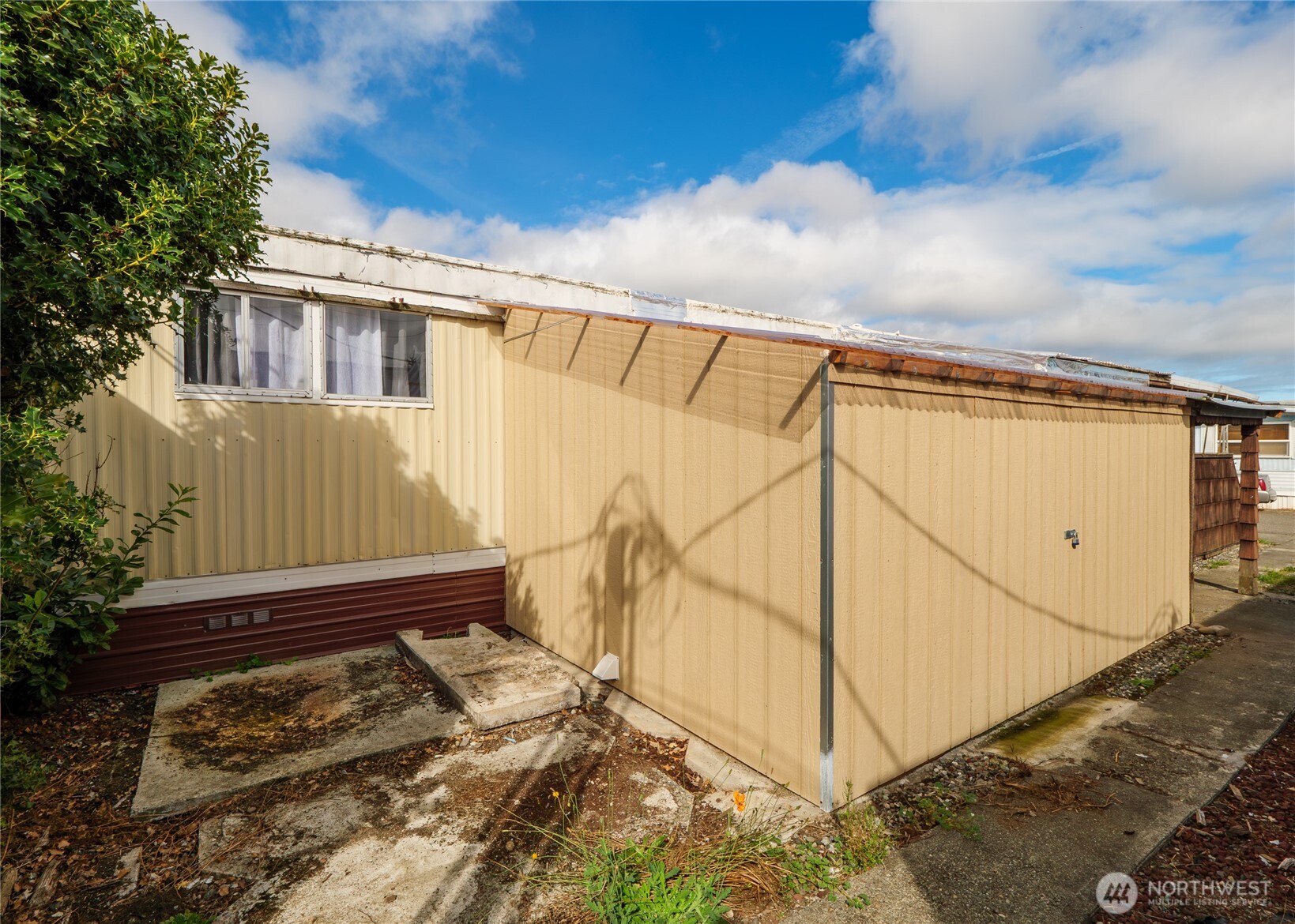 201 North 5th Avenue, Unit 19 Sequim, WA 98382 - Photo 22 of 25 a view of a house with a wooden wall
