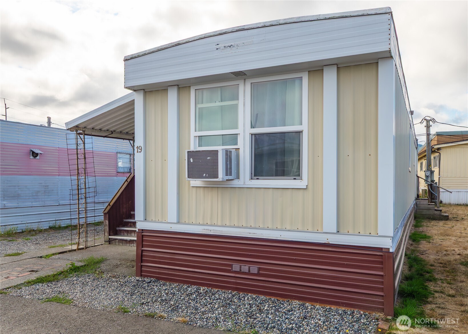 201 North 5th Avenue, Unit 19 Sequim, WA 98382 - Photo 3 of 25 a front view of a house with a yard