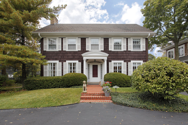645 Hill Road Winnetka, IL 60093 - Photo 2 of 12 a front view of a house with garden