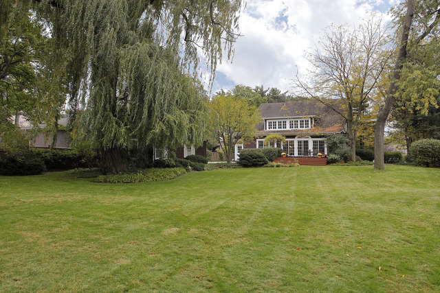 645 Hill Road Winnetka, IL 60093 - Photo 11 of 12 a front view of a house with a yard