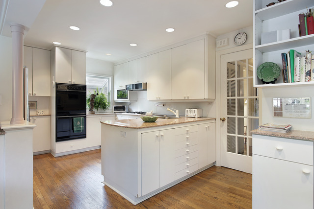 645 Hill Road Winnetka, IL 60093 - Photo 5 of 12 a kitchen with a sink stainless steel appliances and cabinets