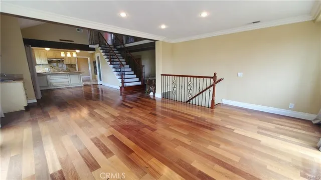 a view of an entryway with wooden floor