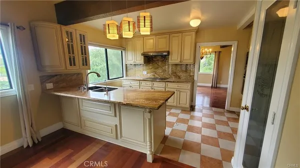 a kitchen with a sink and a refrigerator