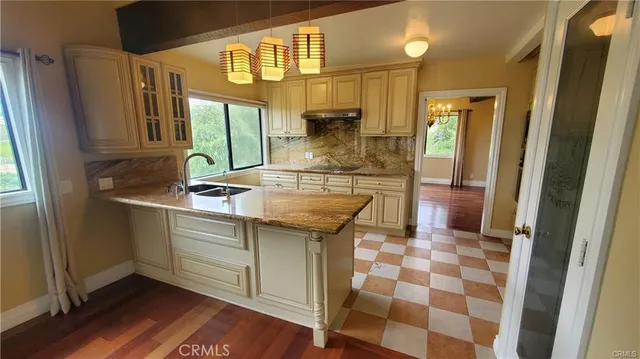 a kitchen with a sink and a refrigerator