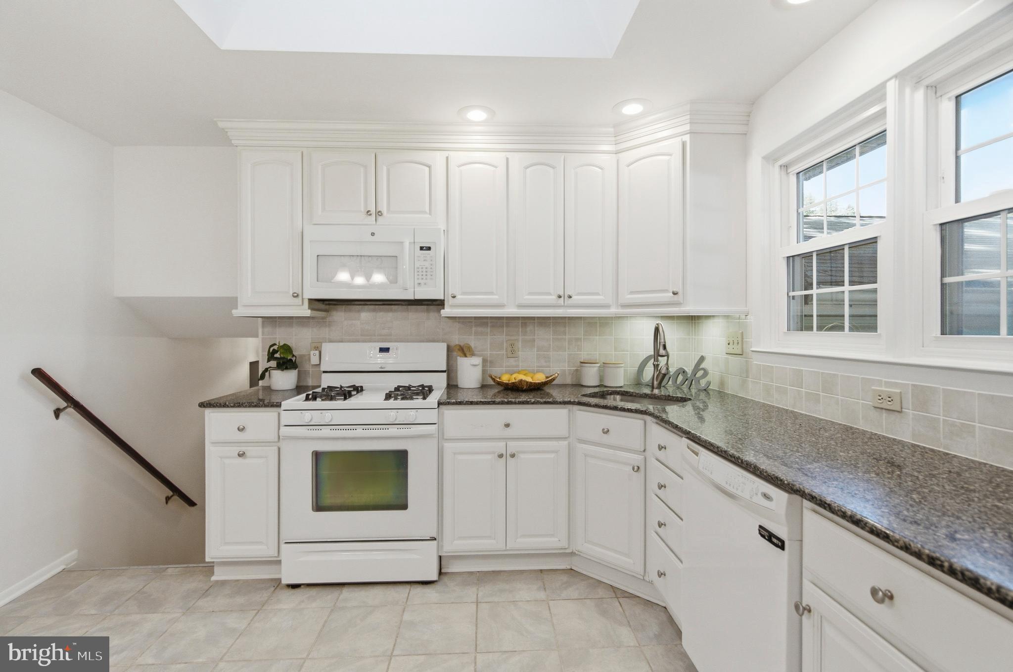 220 Solway Road Lutherville-Timonium, MD 21093 - Photo 8 of 38 a kitchen with cabinets appliances and a sink