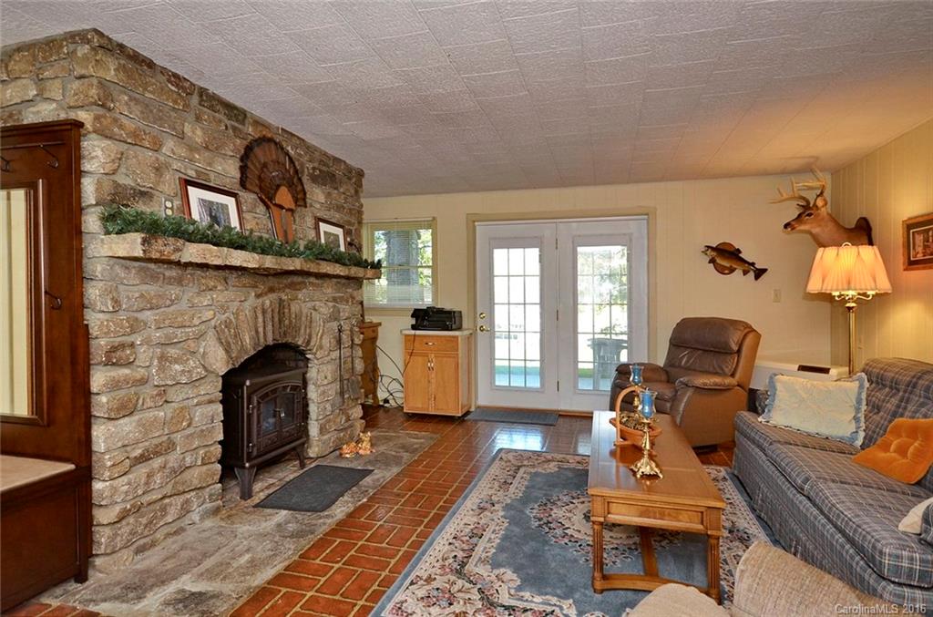 110-114 Hilltop Road Waynesville, NC 28786 - Photo 16 of 21 a living room with furniture and a fireplace