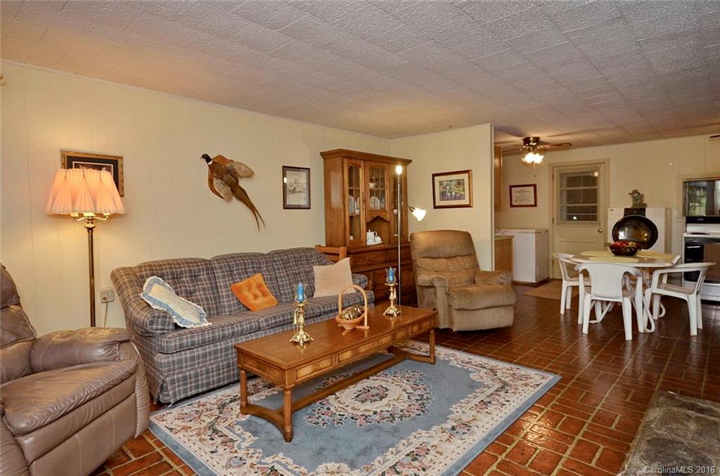 110-114 Hilltop Road Waynesville, NC 28786 - Photo 17 of 21 a living room with furniture and wooden floor