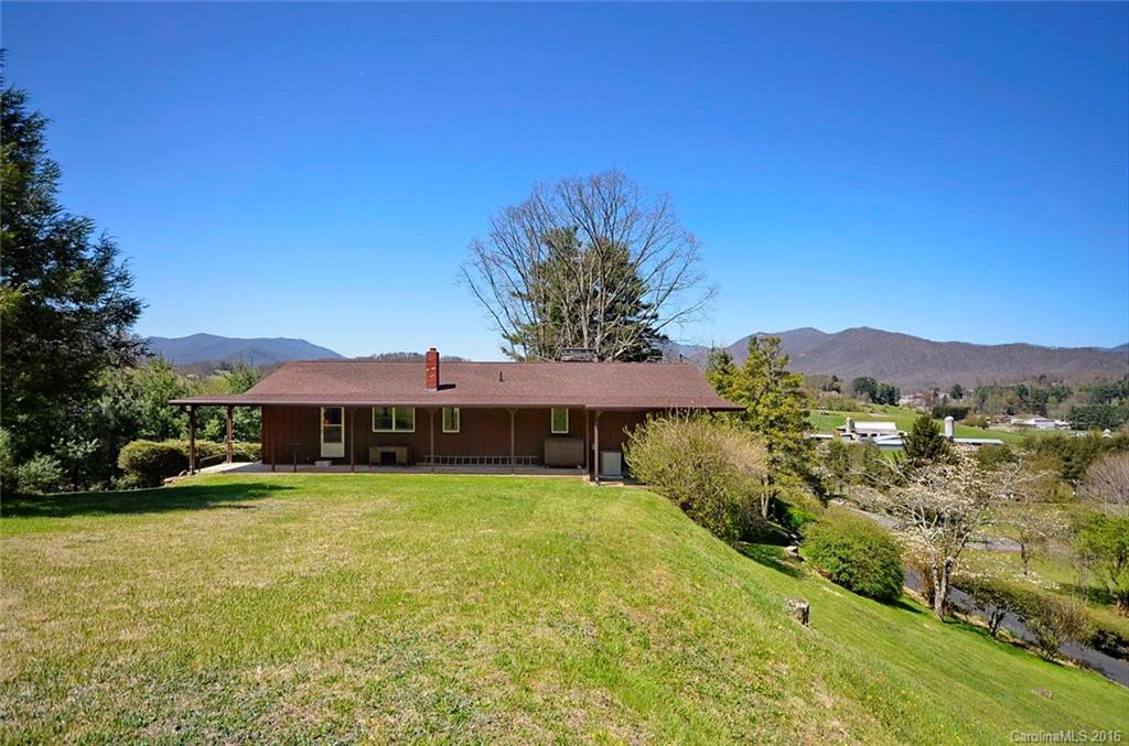 110-114 Hilltop Road Waynesville, NC 28786 - Photo 21 of 21 a view of a house with a yard