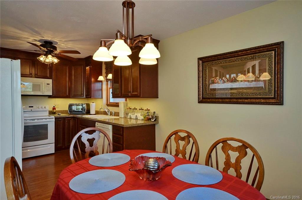 110-114 Hilltop Road Waynesville, NC 28786 - Photo 8 of 21 a dining room with furniture and window