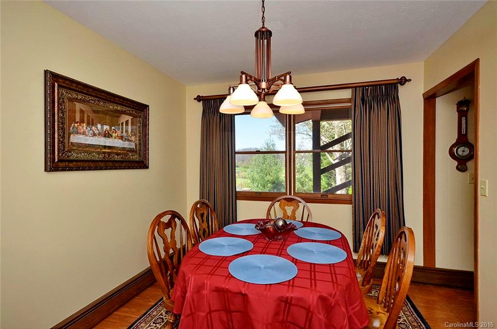 110-114 Hilltop Road Waynesville, NC 28786 - Photo 9 of 21 a dining room with furniture and window