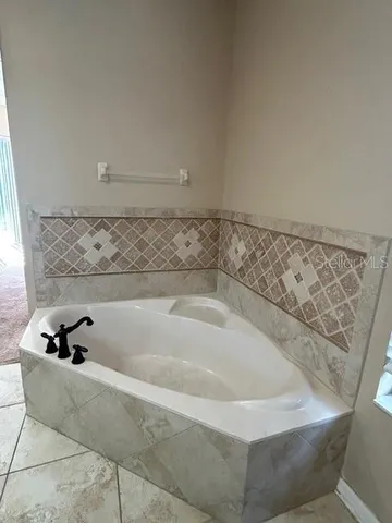 a bath tub sitting in a bathroom