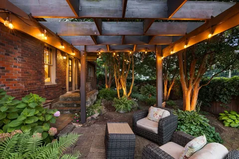 a view of a chairs and table in a patio