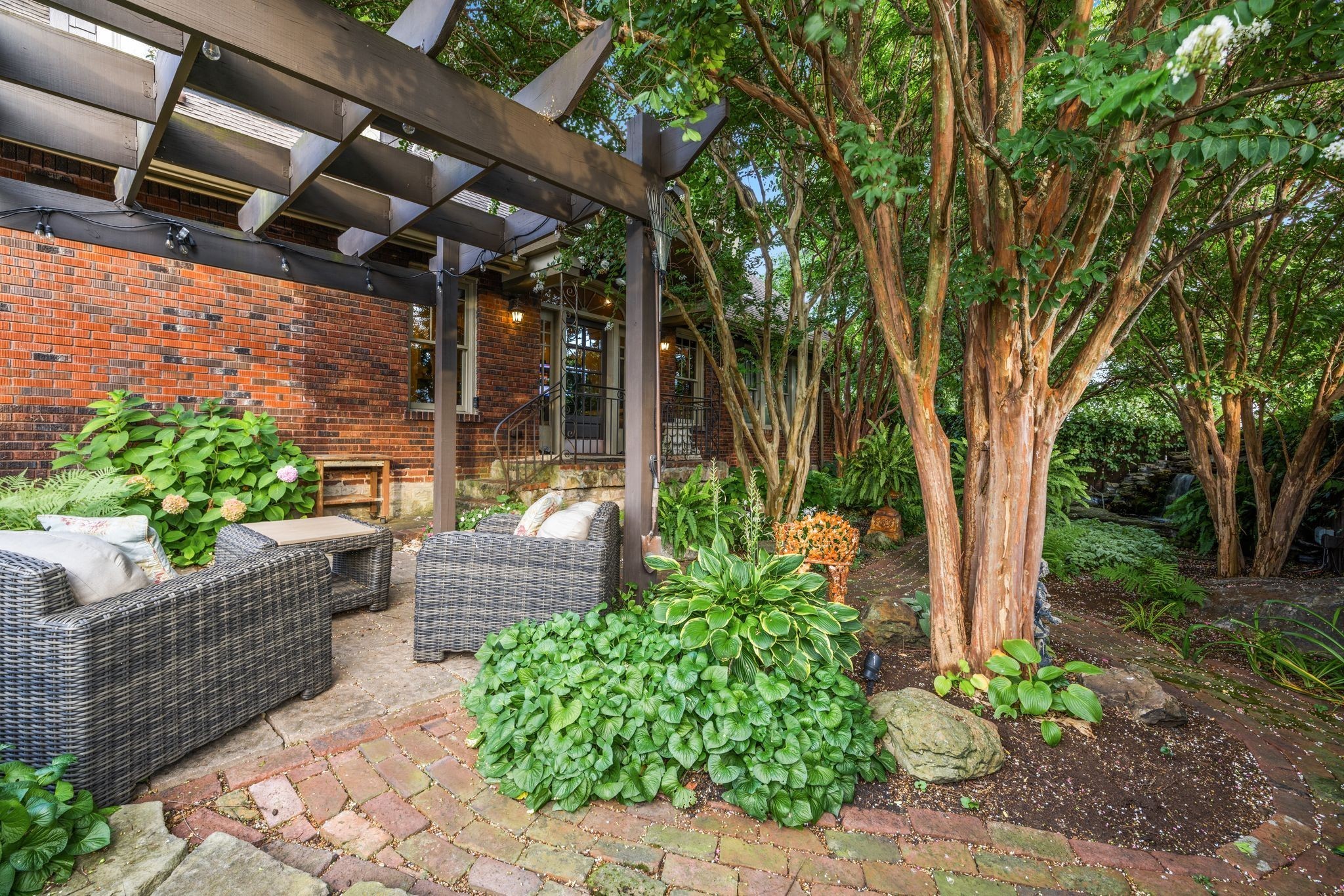 707 Inverness Avenue Nashville, TN 37204 - Photo 20 of 45 a view of small yard in front of house with a fountain