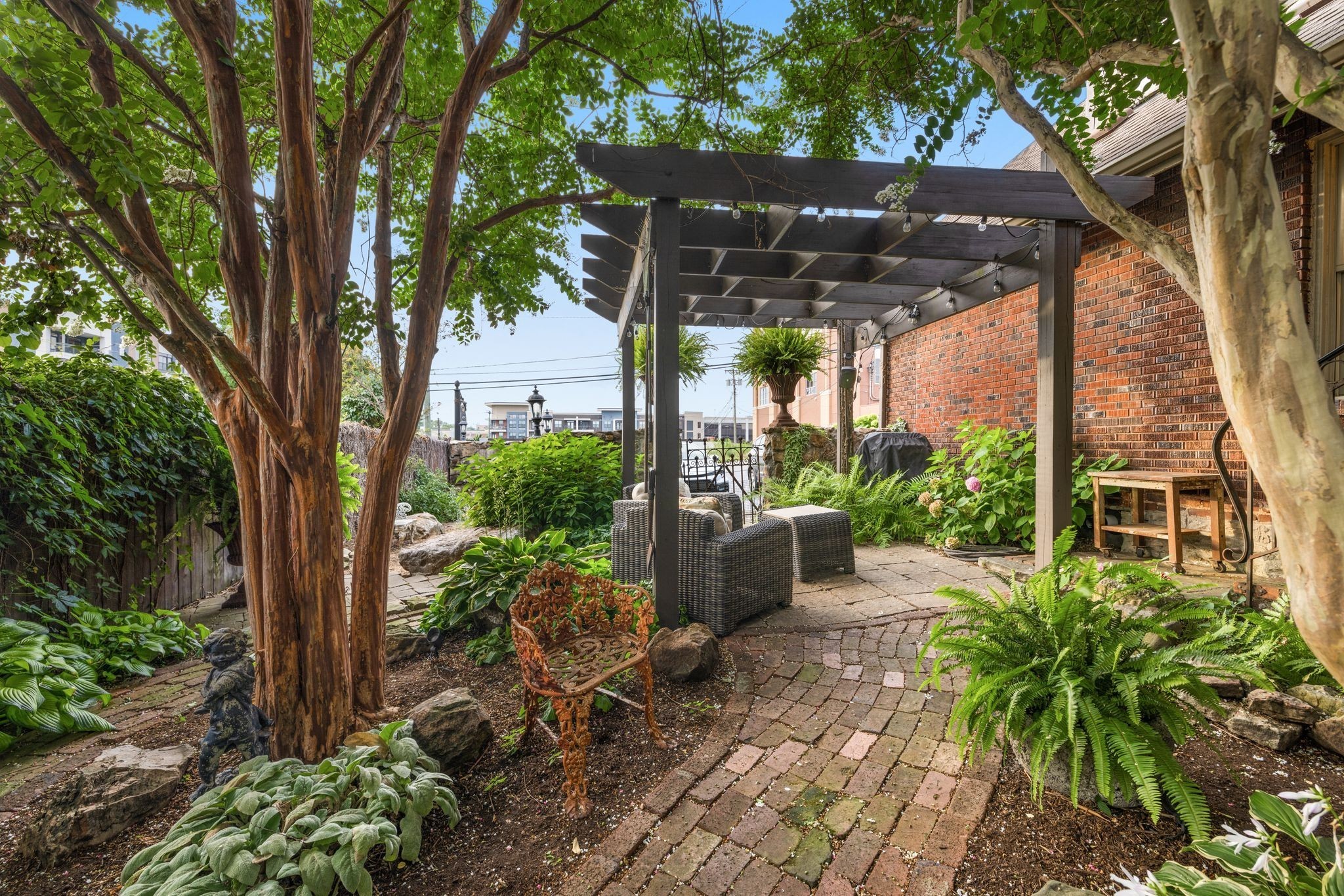 707 Inverness Avenue Nashville, TN 37204 - Photo 21 of 45 a view of a patio with table and chairs potted plants and large tree