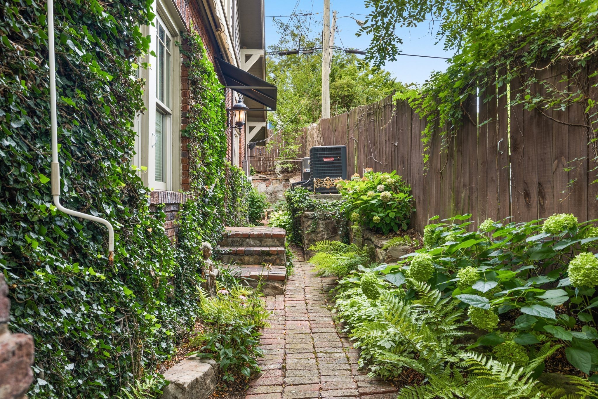 707 Inverness Avenue Nashville, TN 37204 - Photo 23 of 45 a view of house with backyard sitting area and garden