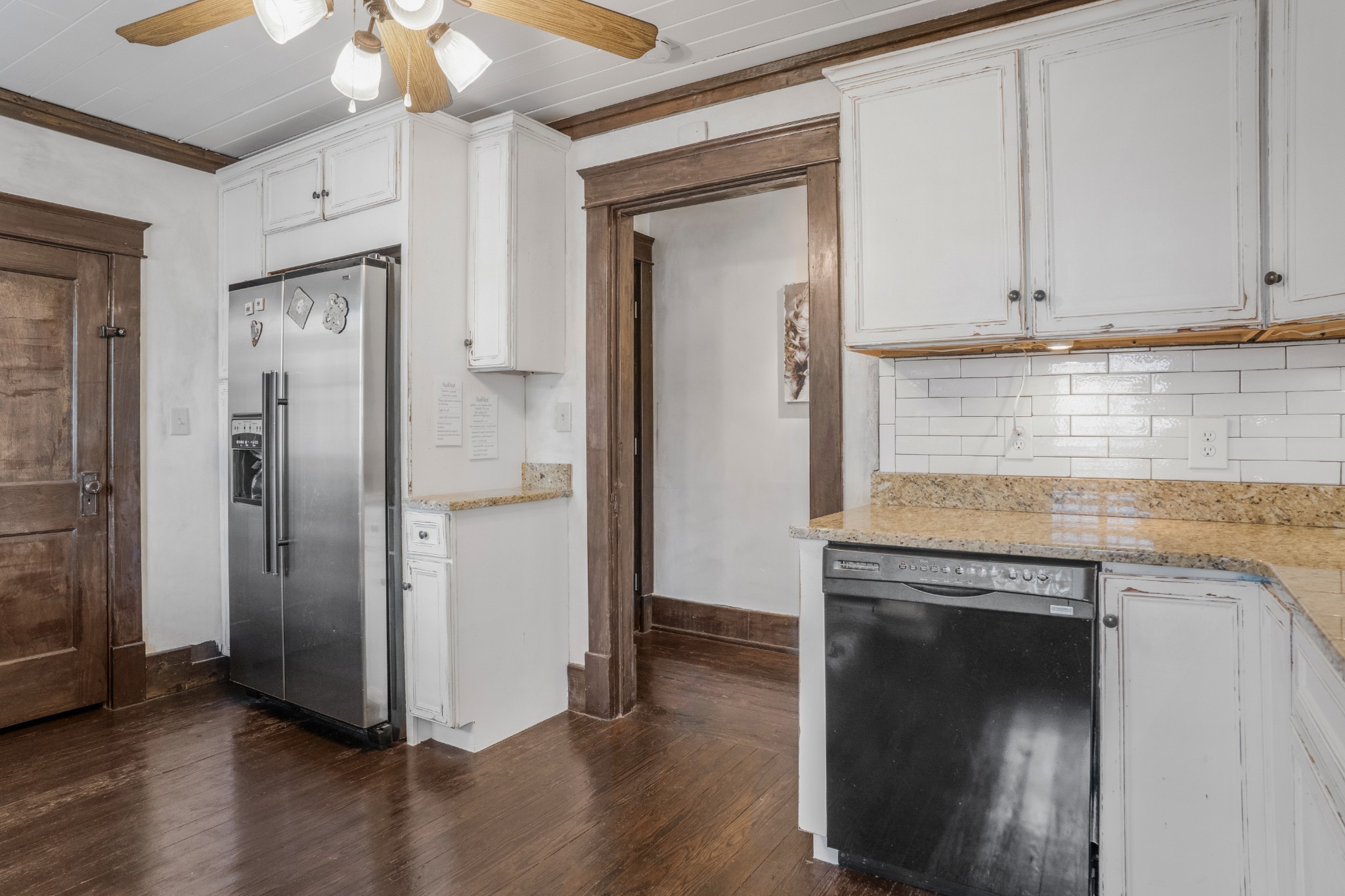 707 Inverness Avenue Nashville, TN 37204 - Photo 32 of 45 an empty room with wooden floor and cabinet