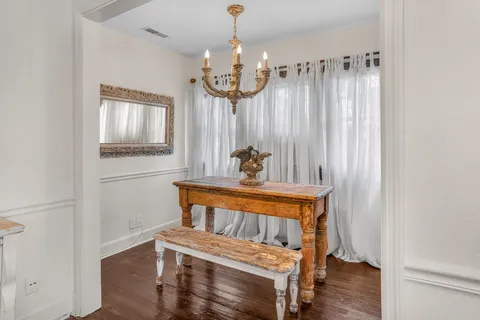 a view of bedroom with furniture and chandelier