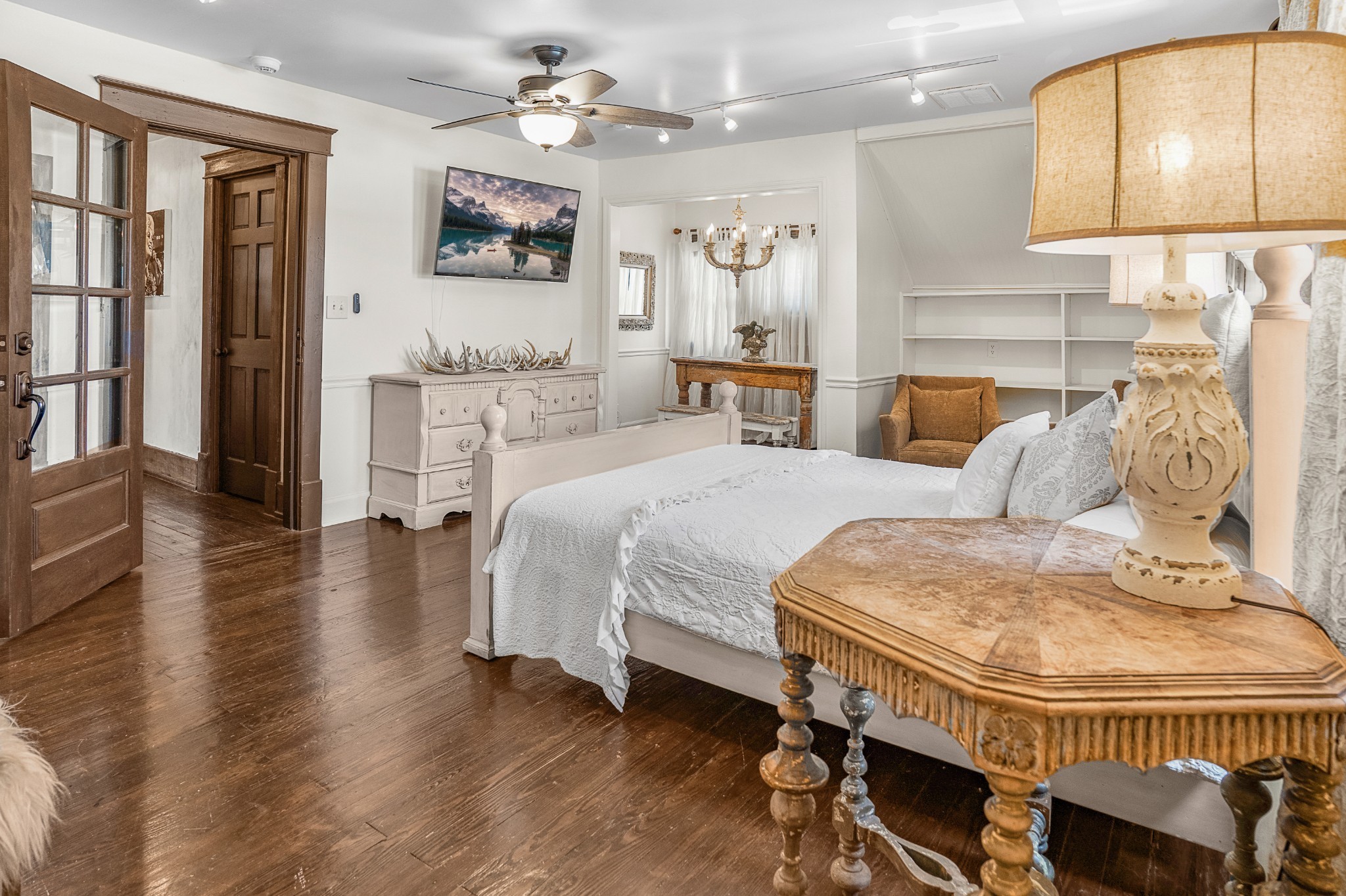 707 Inverness Avenue Nashville, TN 37204 - Photo 37 of 45 a spacious bedroom with a bed a mirror and furniture