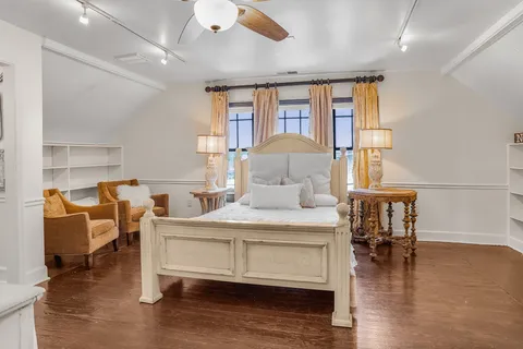 a bedroom with a bed and a table in it