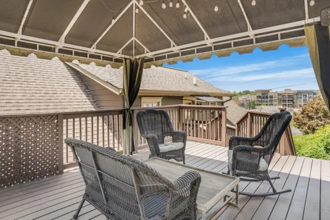 a view of a balcony with furniture