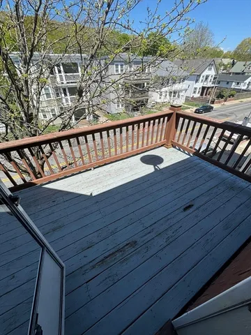 a view of balcony with wooden floor