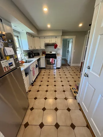 a large kitchen with cabinets