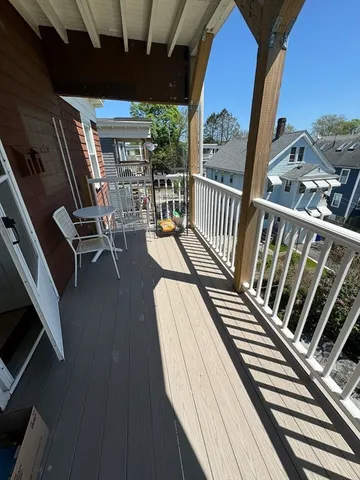a view of a balcony with chairs