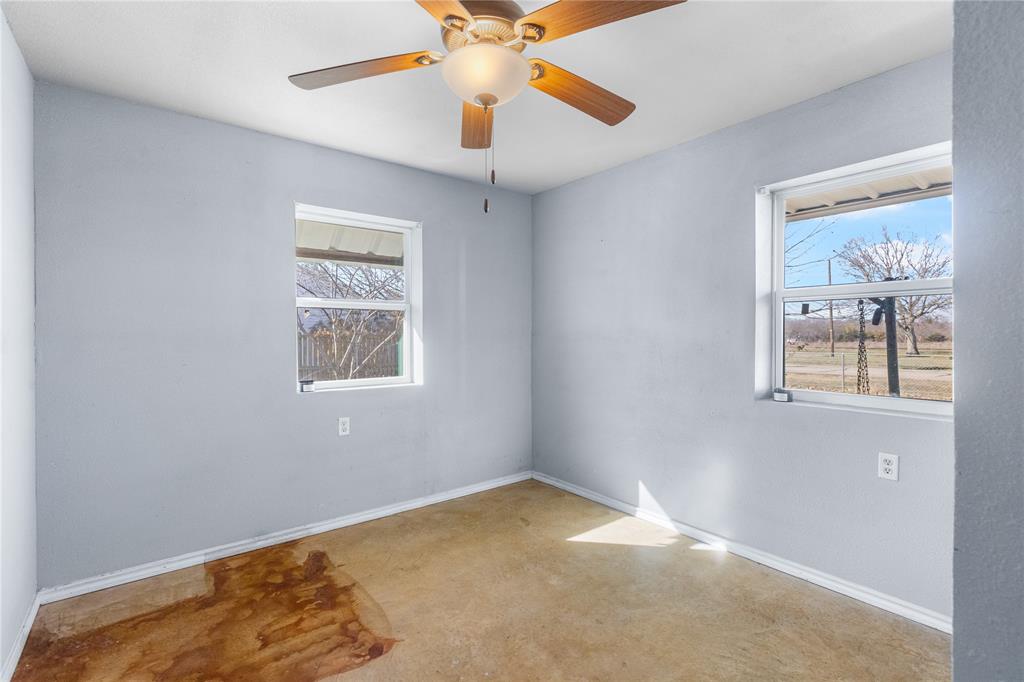 702 Main Windom, TX 75492 - Photo 14 of 30 a view of room with window and ceiling fan