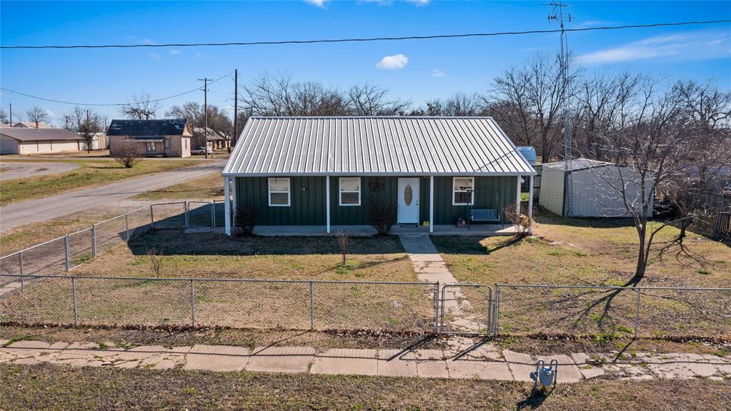 702 Main Windom, TX 75492 - Photo 17 of 30 a front view of a house with garden