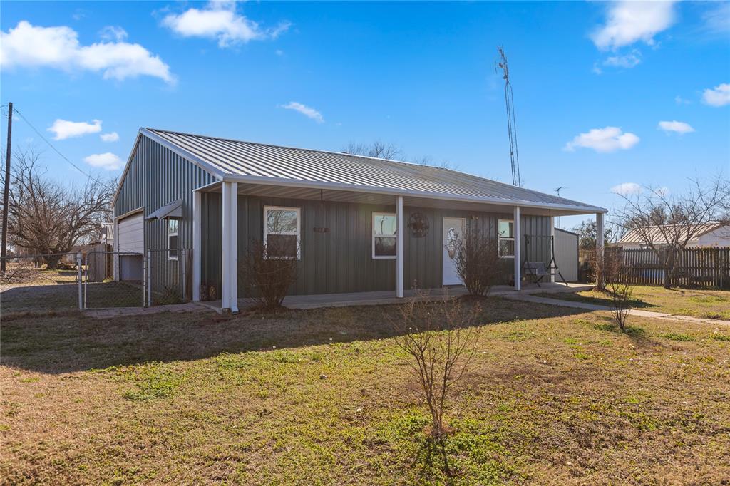 702 Main Windom, TX 75492 - Photo 2 of 30 a front view of a house with a yard