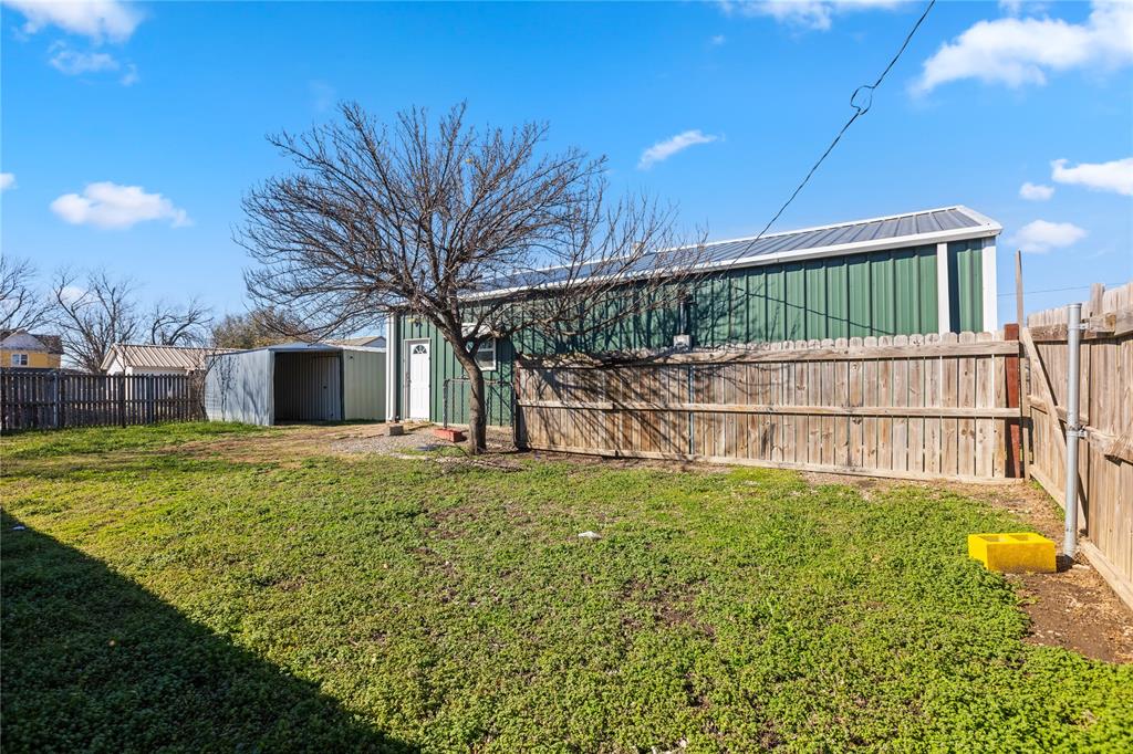 702 Main Windom, TX 75492 - Photo 22 of 30 a view of a backyard with a garden and plants
