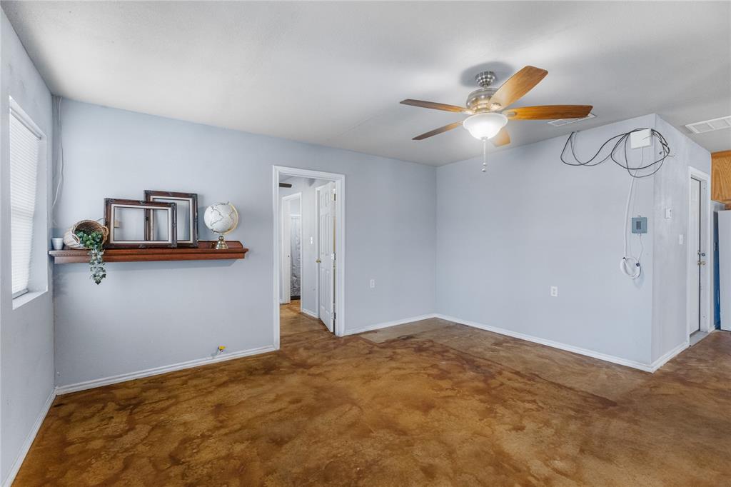 702 Main Windom, TX 75492 - Photo 6 of 30 a bedroom with a bed and cabinets