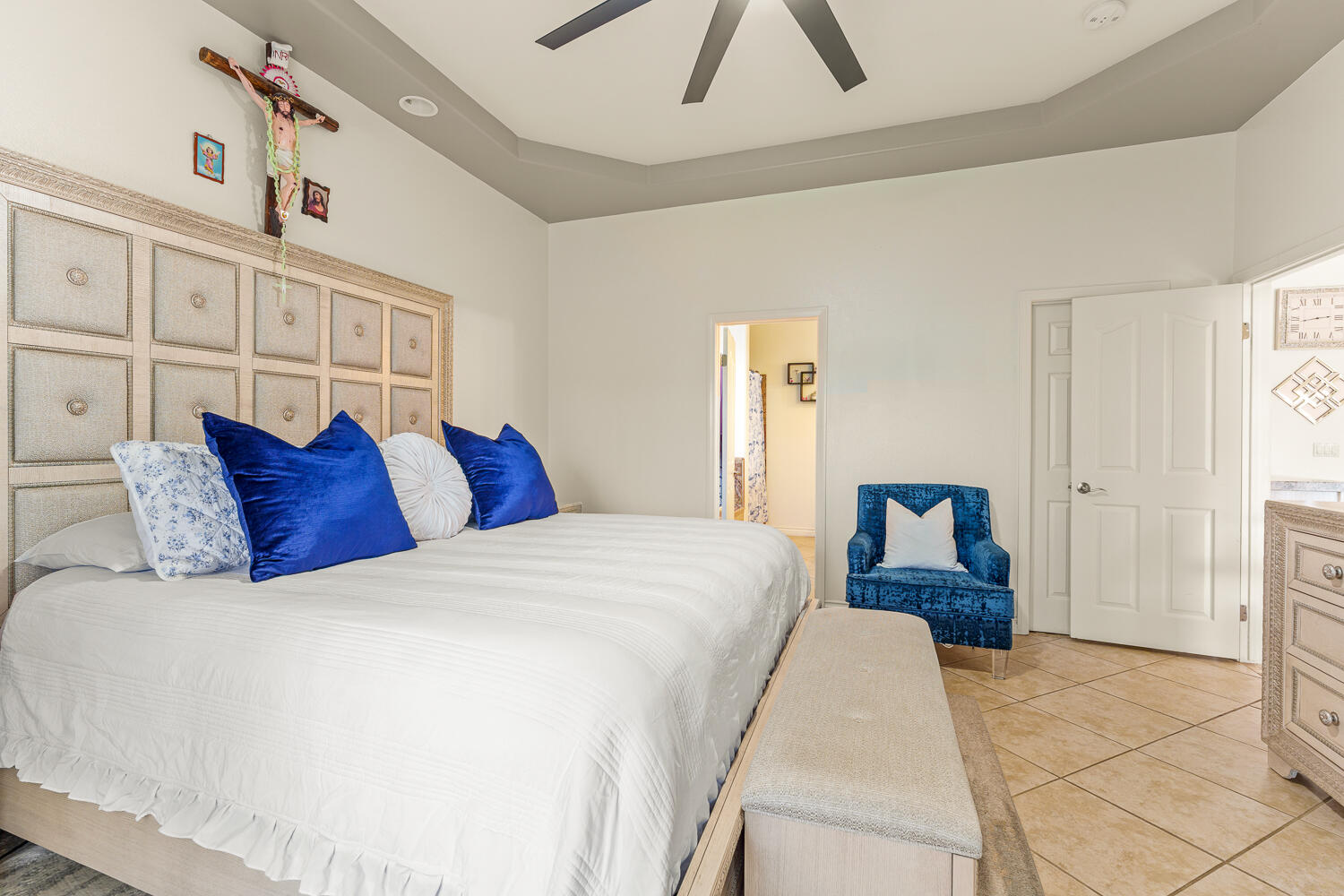 67305 Medano Road Cathedral City, CA 92234 - Photo 11 of 37 a spacious bedroom with a large bed and a chandelier