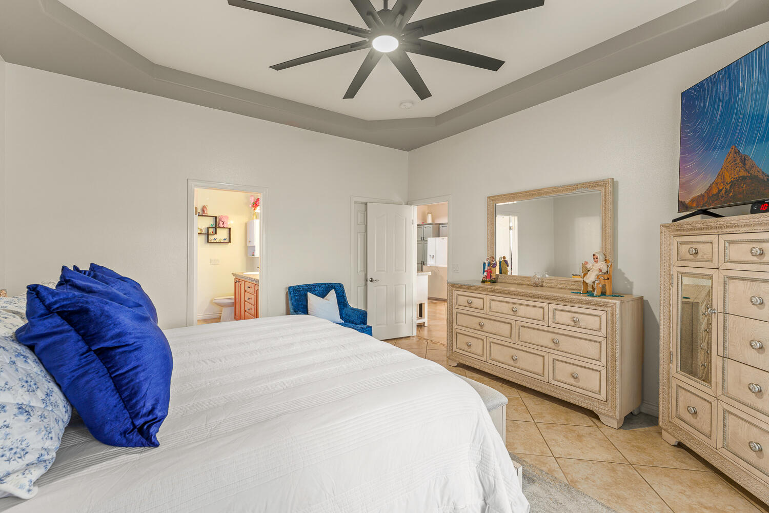 67305 Medano Road Cathedral City, CA 92234 - Photo 12 of 37 a bedroom with a bed and ceiling fan