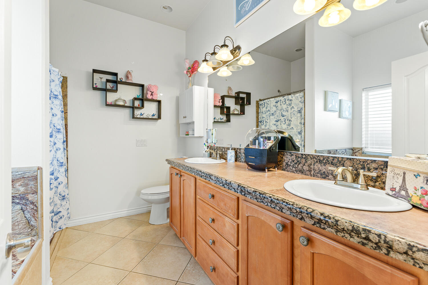 67305 Medano Road Cathedral City, CA 92234 - Photo 13 of 37 a spacious bathroom with a granite countertop double vanity sink mirror and