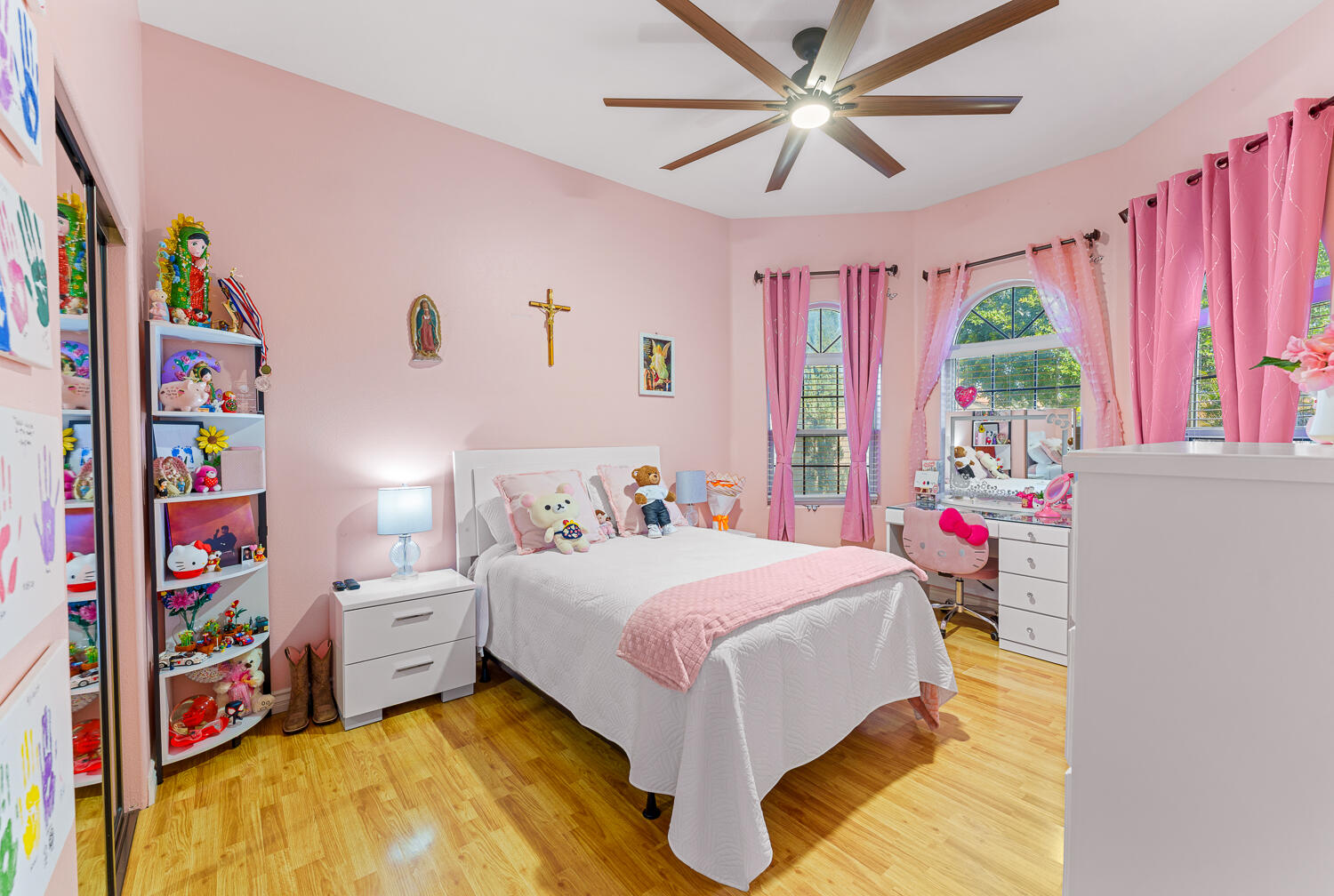67305 Medano Road Cathedral City, CA 92234 - Photo 15 of 37 a bedroom with a bed cabinets and a large window