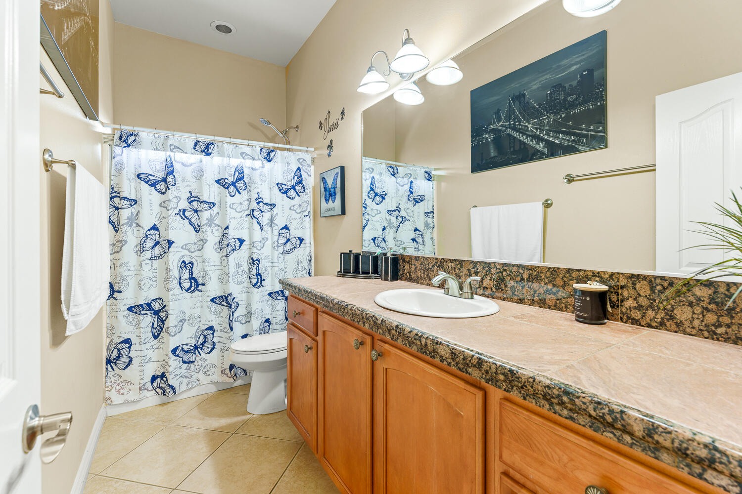 67305 Medano Road Cathedral City, CA 92234 - Photo 21 of 37 a bathroom with a granite countertop sink mirror vanity and toilet