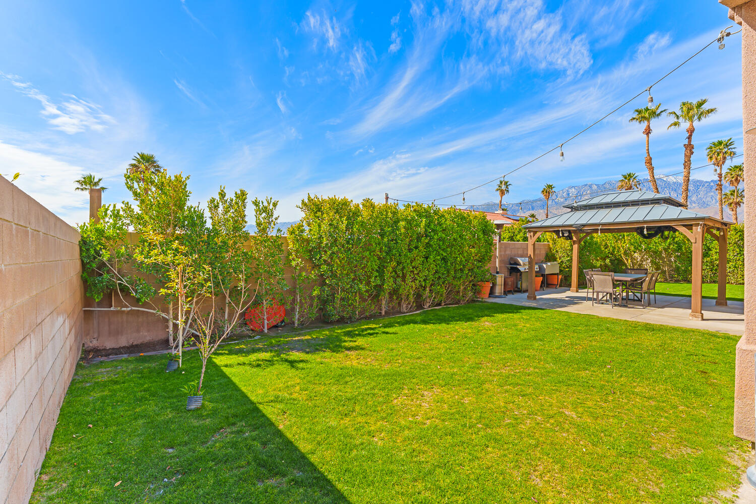 67305 Medano Road Cathedral City, CA 92234 - Photo 26 of 37 a view of yard with swimming pool and green space