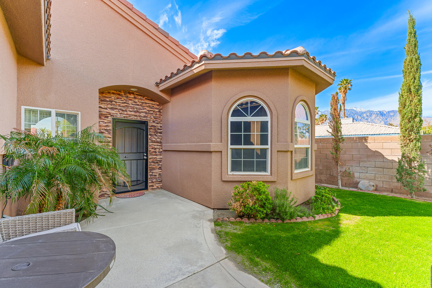 67305 Medano Road Cathedral City, CA 92234 - Photo 30 of 37 a front view of a house with a yard