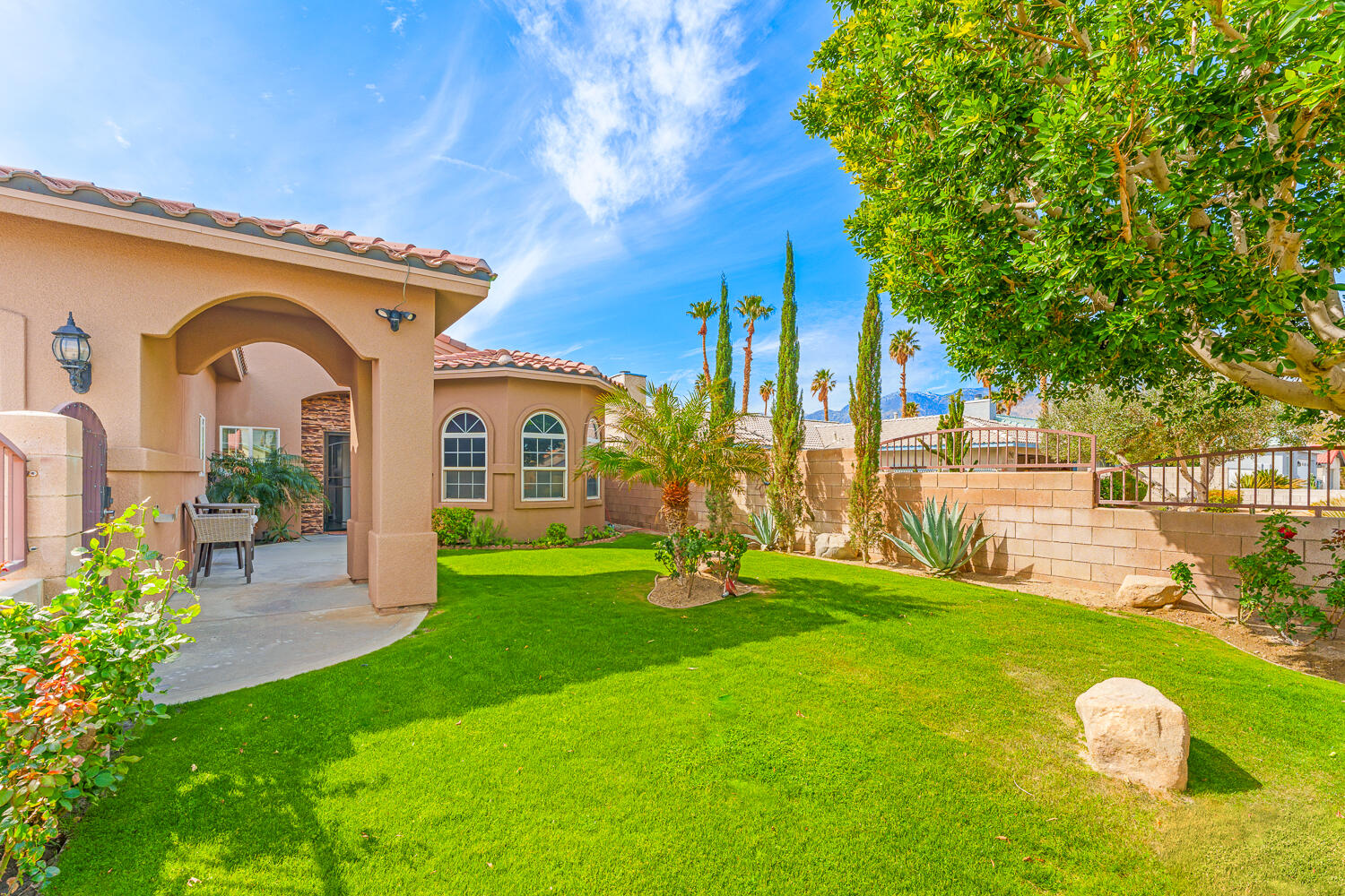 67305 Medano Road Cathedral City, CA 92234 - Photo 32 of 37 a front view of a house with garden