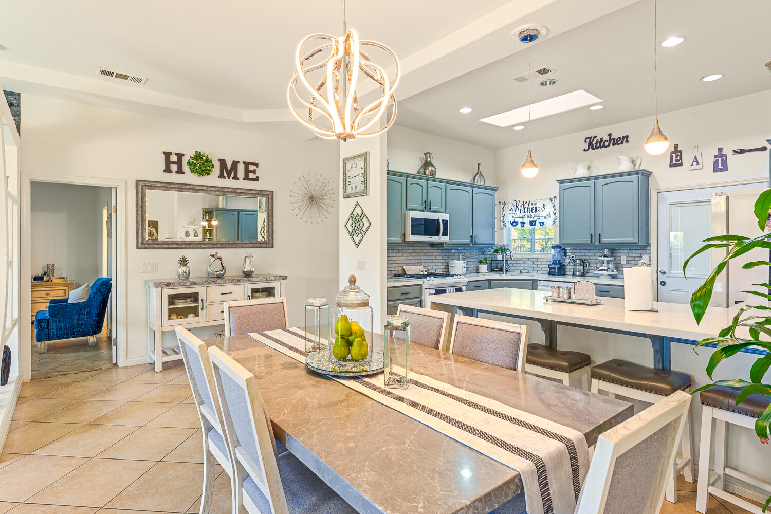67305 Medano Road Cathedral City, CA 92234 - Photo 5 of 37 a large kitchen with a table and chairs