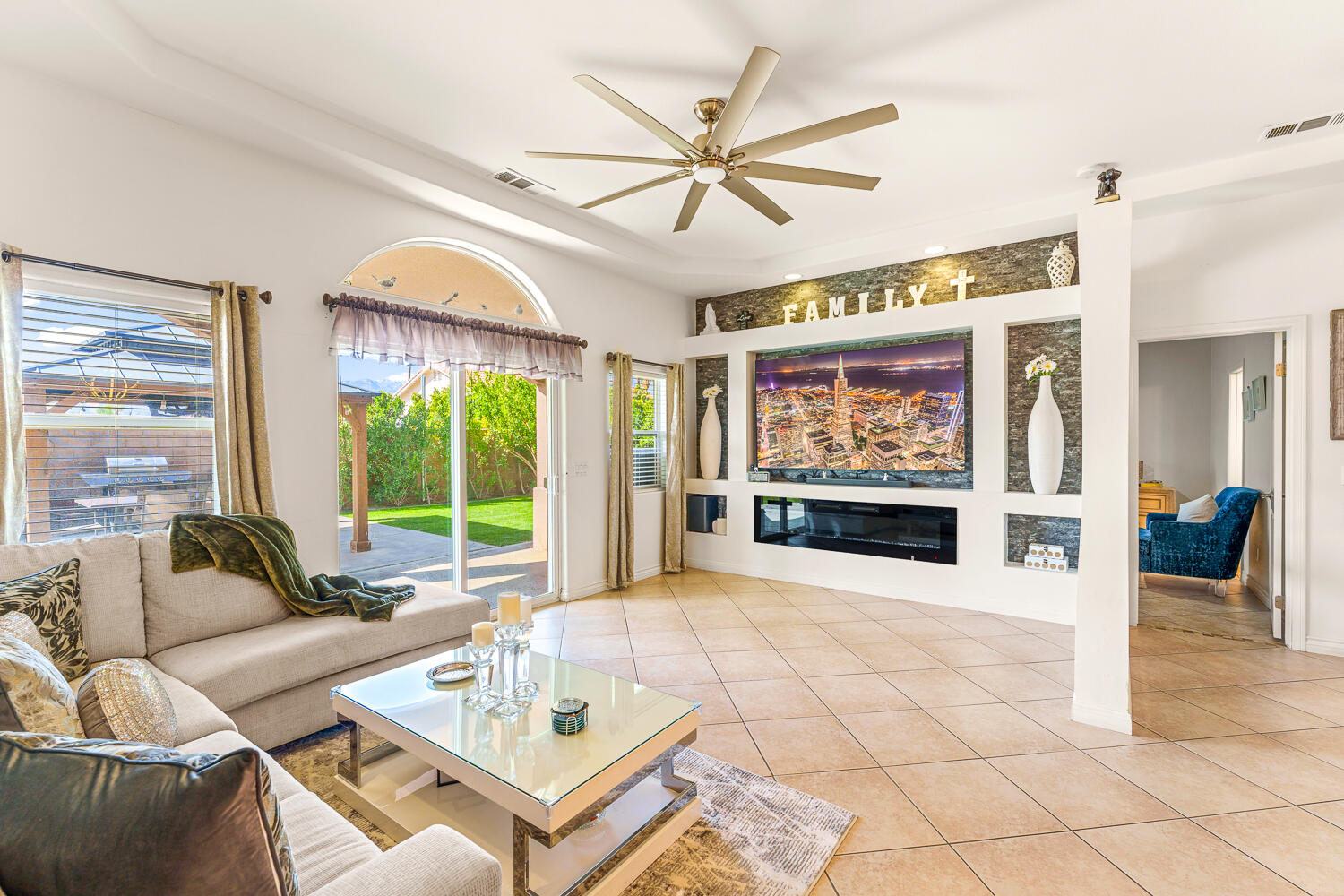 67305 Medano Road Cathedral City, CA 92234 - Photo 9 of 37 a living room with fireplace furniture and a large window