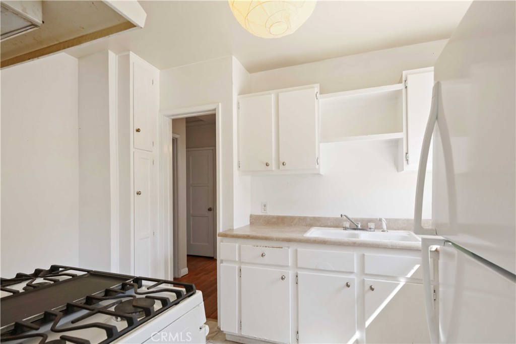 5940 Cedros Avenue Van Nuys, CA 91411 - Photo 11 of 23 a bathroom with a granite countertop sink and a window