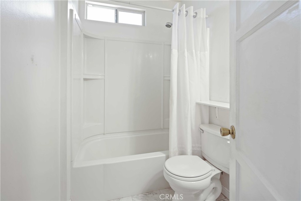 5940 Cedros Avenue Van Nuys, CA 91411 - Photo 14 of 23 a bathroom with a toilet and a shower