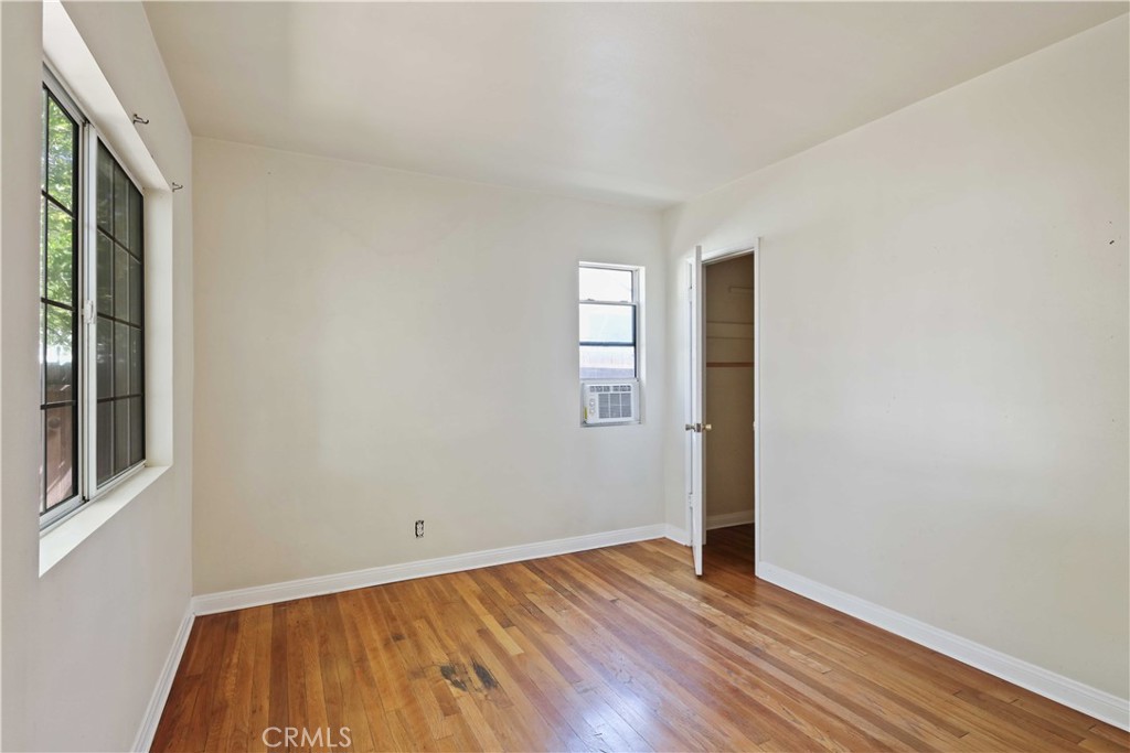 5940 Cedros Avenue Van Nuys, CA 91411 - Photo 16 of 23 a view of an empty room with wooden floor and a window