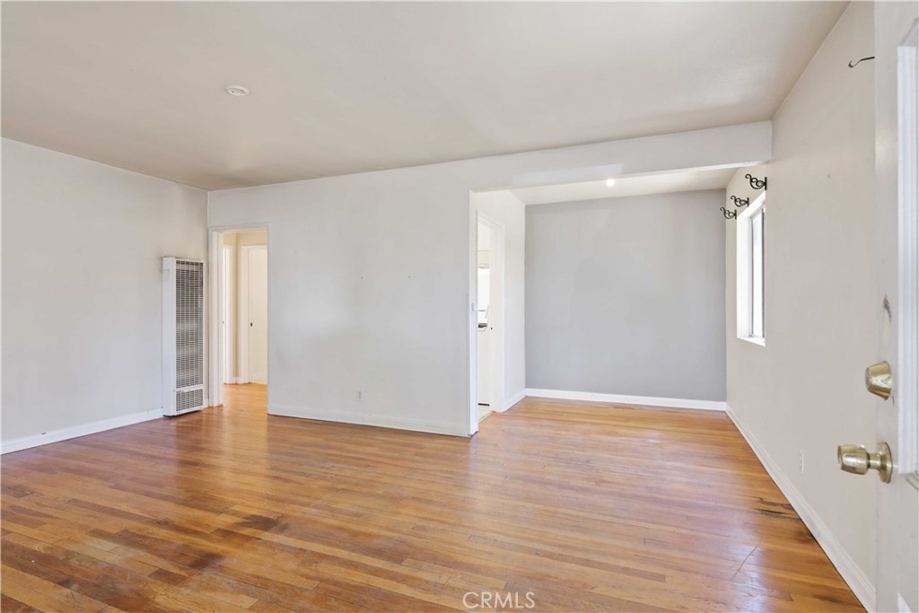 5940 Cedros Avenue Van Nuys, CA 91411 - Photo 3 of 23 a view of an empty room with wooden floor