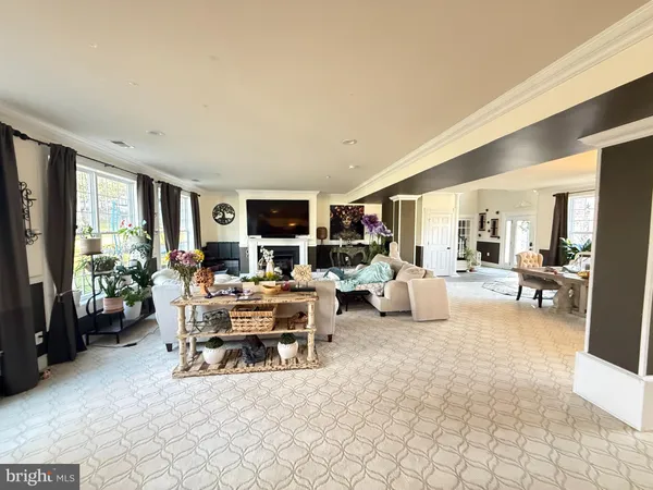 a view of a livingroom with furniture and a flat screen tv