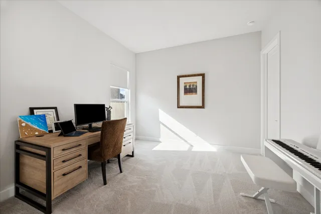 a view of a workspace with furniture and a air conditioner