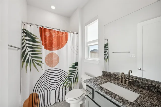 a bathroom with a sink a mirror and a toilet